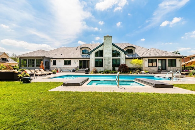 view of pool featuring a patio, an in ground hot tub, and a yard