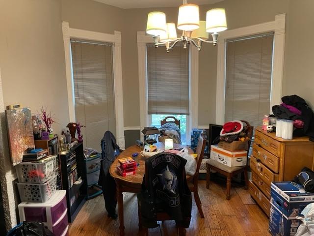 dining space featuring a chandelier and hardwood / wood-style floors