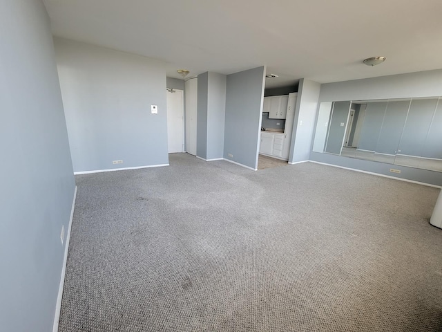 interior space featuring light colored carpet