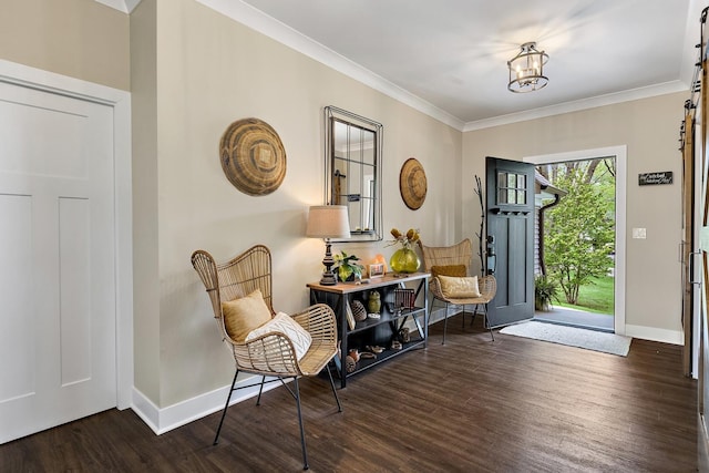 entryway with a barn door, crown molding, and dark wood-type flooring