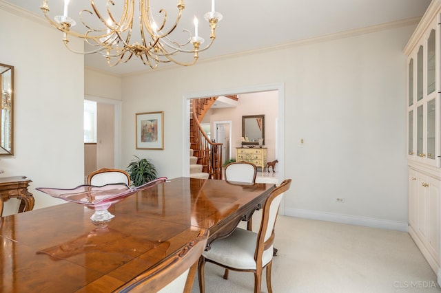 carpeted dining area featuring a notable chandelier and crown molding