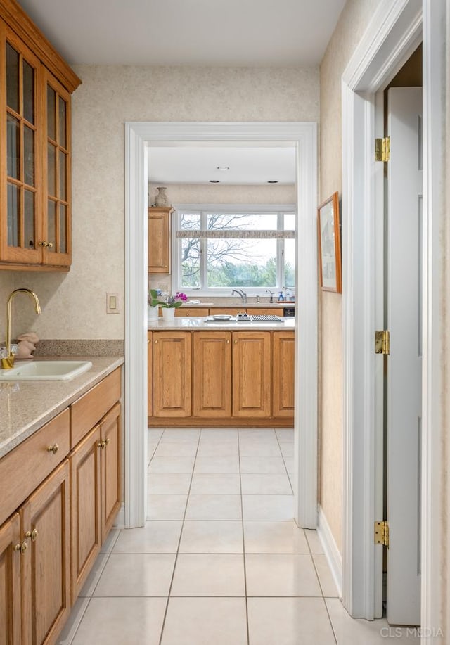 kitchen with sink and light tile flooring