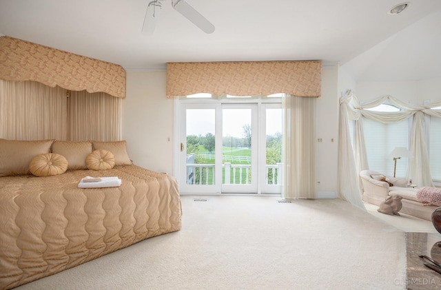 carpeted bedroom with ceiling fan and access to exterior