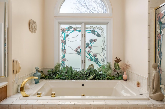 bathroom with tiled bath