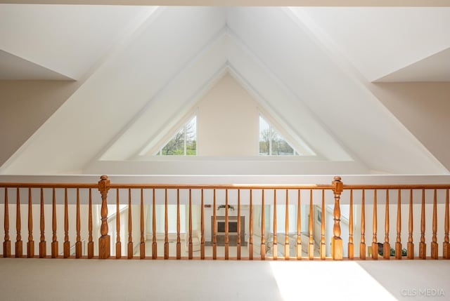 bonus room with carpet floors and vaulted ceiling