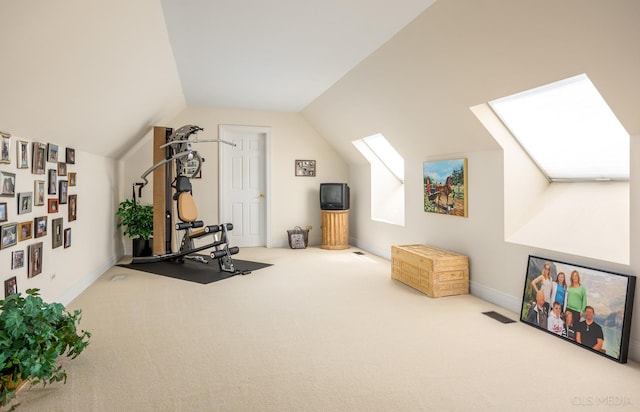 exercise area with carpet and vaulted ceiling