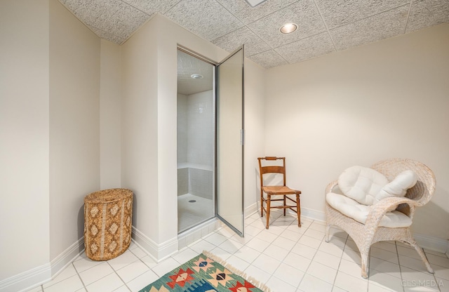 living area featuring light tile flooring