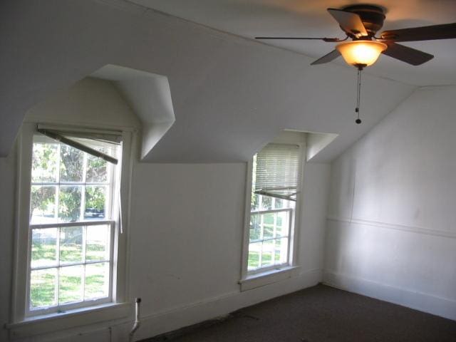 additional living space with lofted ceiling and ceiling fan