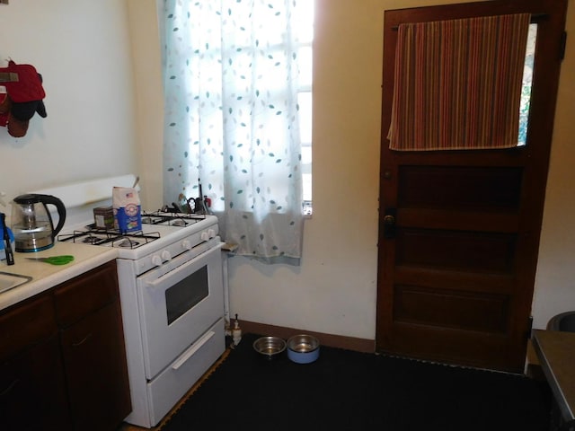 kitchen with white range with gas cooktop