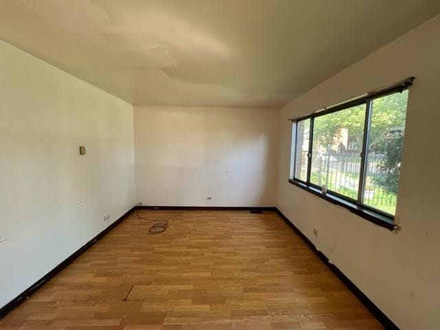 spare room with light hardwood / wood-style floors