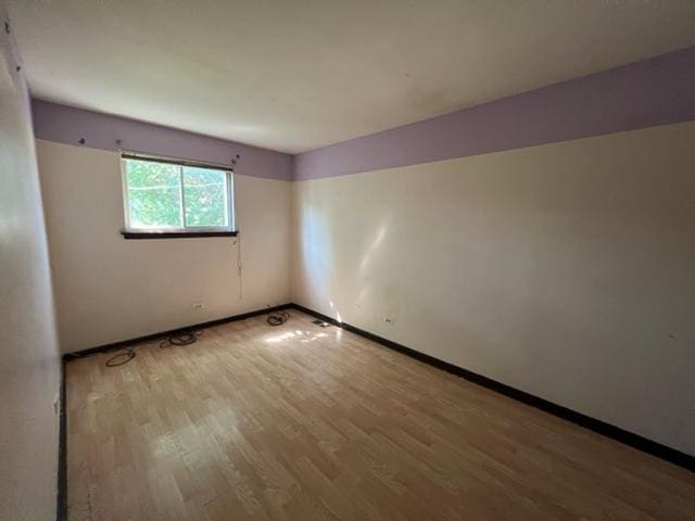 empty room featuring wood-type flooring