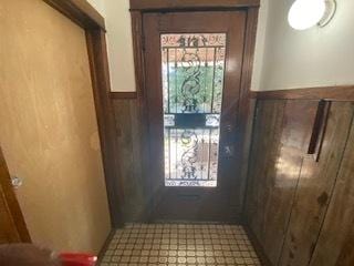 doorway with tile floors