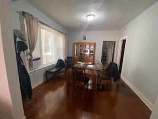 dining room with dark wood-type flooring