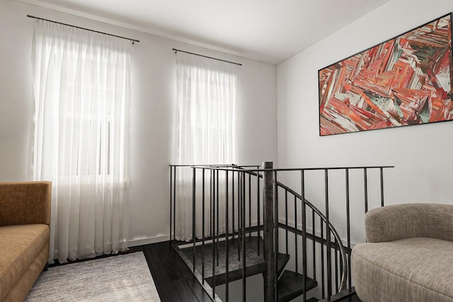 staircase with dark wood-type flooring