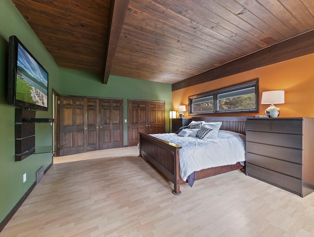 bedroom featuring wooden ceiling, light hardwood / wood-style flooring, and beamed ceiling