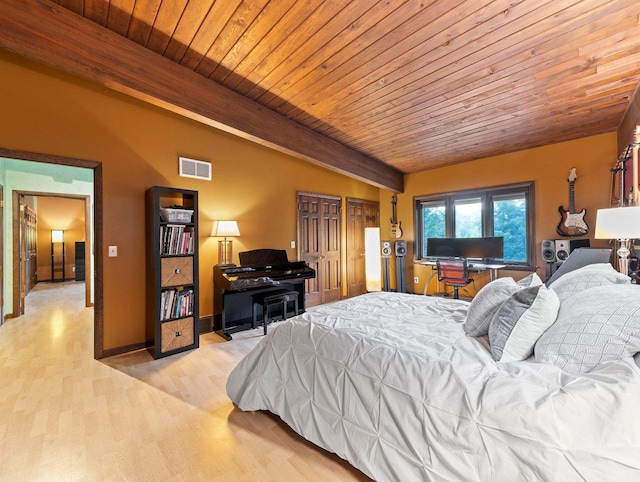 bedroom with wood ceiling, light hardwood / wood-style flooring, and beamed ceiling