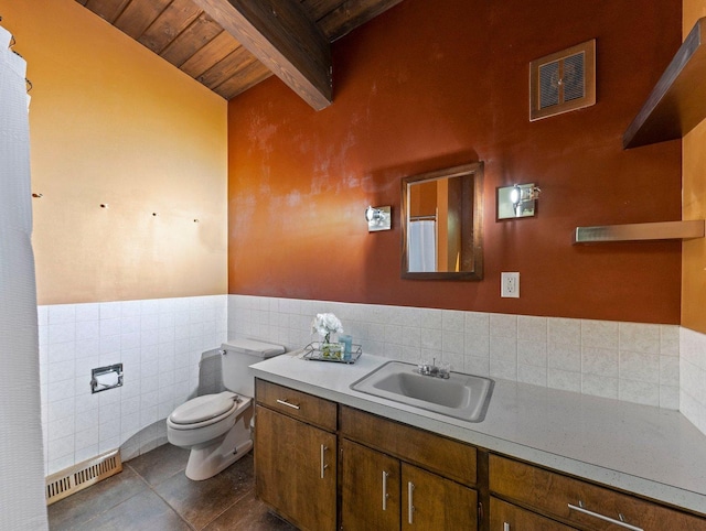 bathroom featuring tile walls, toilet, tile flooring, tasteful backsplash, and vanity