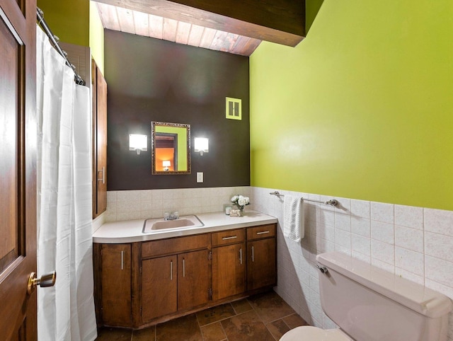 bathroom featuring tile walls, toilet, tile floors, and large vanity