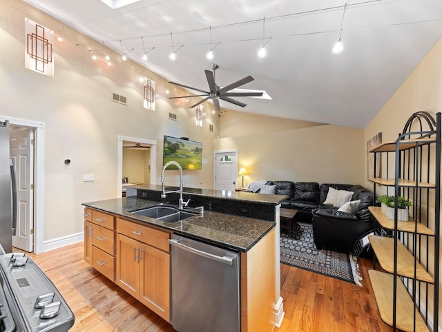 kitchen featuring light hardwood / wood-style floors, rail lighting, stainless steel dishwasher, and ceiling fan