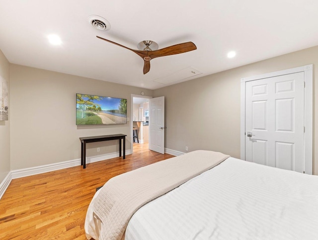 bedroom featuring light hardwood / wood-style floors and ceiling fan