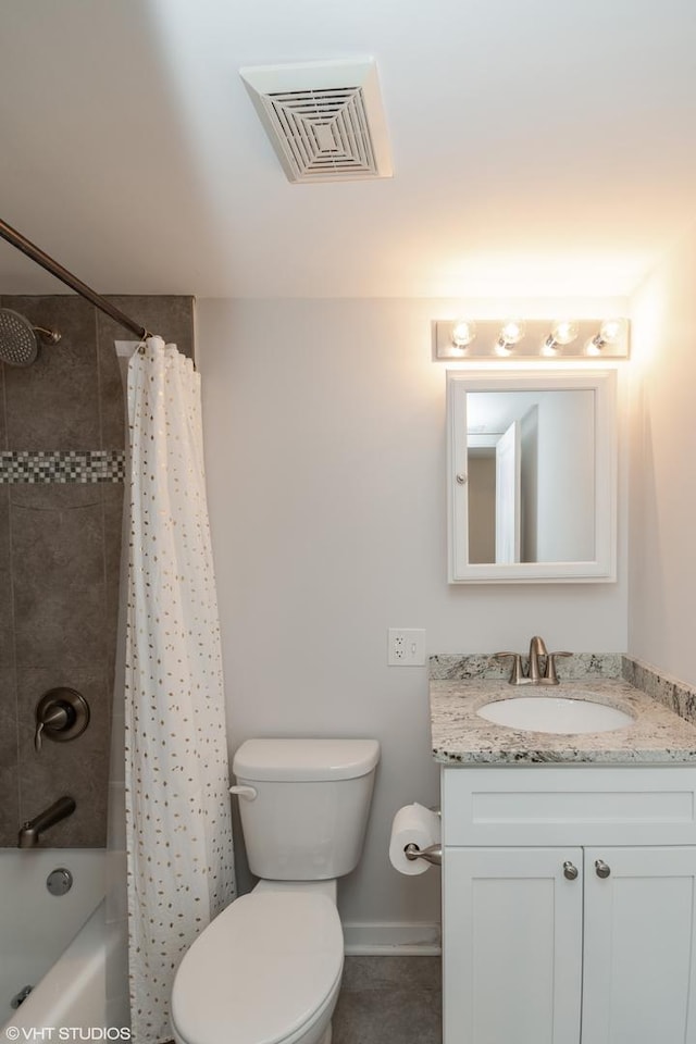 full bathroom with vanity, shower / bath combo with shower curtain, and toilet