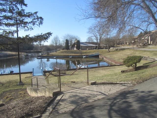 exterior space with a yard and a water view