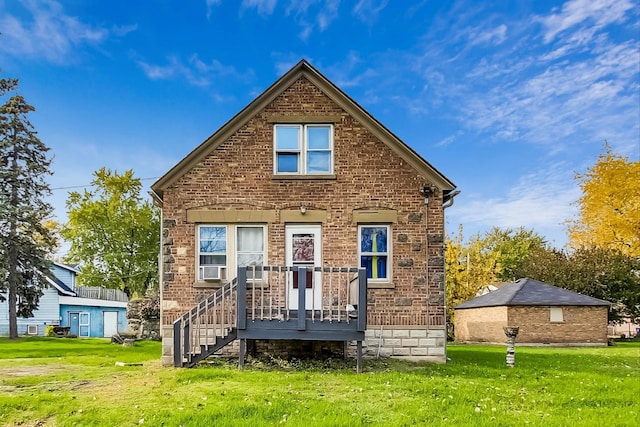 rear view of house with a lawn