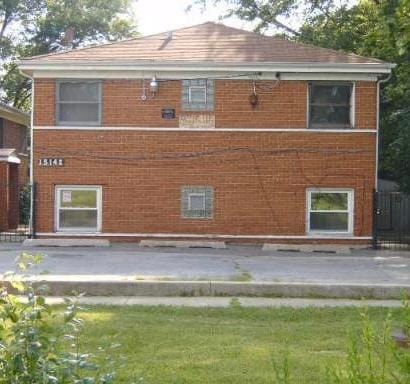 view of side of home featuring a patio