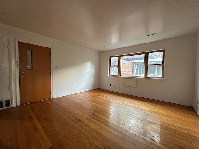 empty room with light wood-type flooring