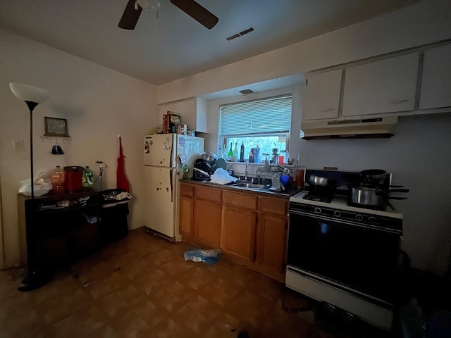 kitchen with ventilation hood, ceiling fan, white appliances, sink, and dark tile flooring