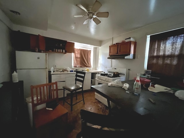 kitchen with ceiling fan and white appliances