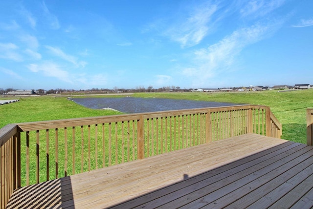 wooden terrace featuring a yard and a rural view