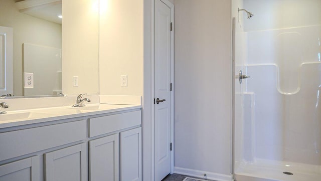 8357 Dylan Dr, Merrillville, IN 46410 - full bathroom featuring double vanity, a shower stall, and a sink