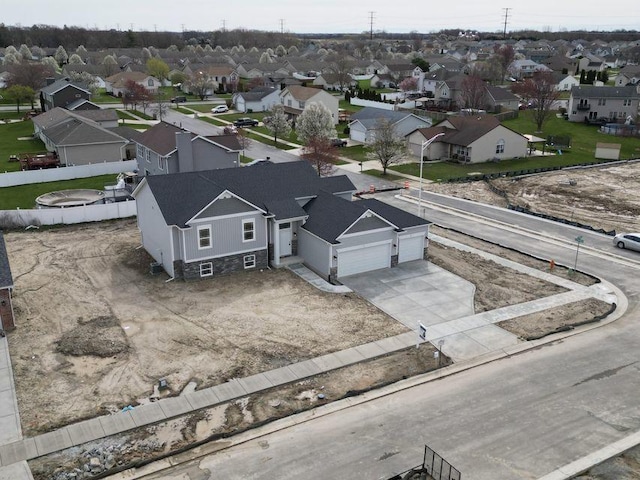 birds eye view of property with a residential view