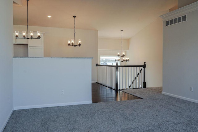 8357 Dylan Dr, Merrillville, IN 46410 - spare room featuring dark colored carpet, recessed lighting, visible vents, a chandelier, and baseboards