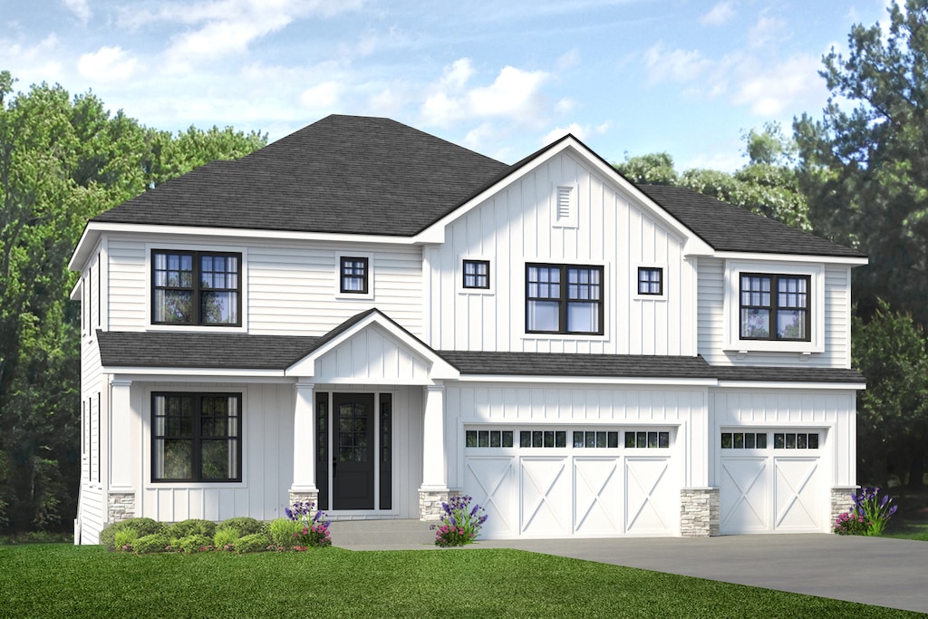 view of front of house with a front lawn and a garage