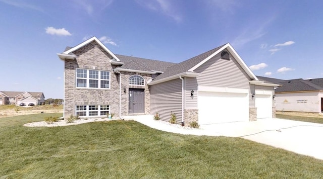 view of front of home featuring a garage, driveway, a front lawn, and brick siding