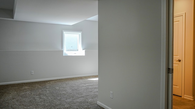 spare room with carpet flooring and baseboards