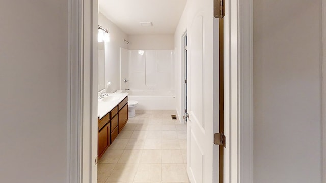 bathroom with toilet, tile patterned flooring, tub / shower combination, and vanity