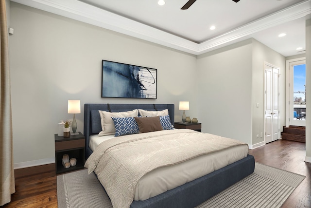 bedroom featuring ceiling fan and dark hardwood / wood-style floors