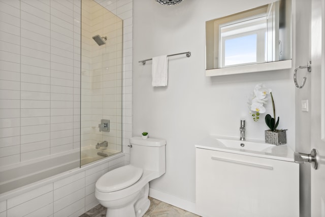 full bathroom featuring toilet, tiled shower / bath combo, and vanity