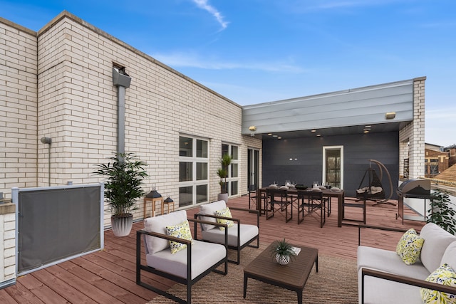 wooden deck with an outdoor hangout area