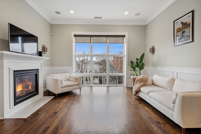 living room with ornamental molding and dark hardwood / wood-style floors