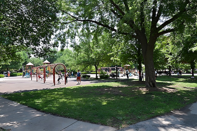 view of playground with a lawn