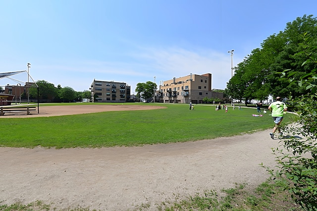 view of home's community featuring a lawn