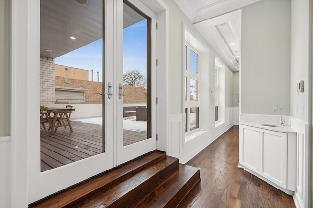 doorway to outside with french doors, dark hardwood / wood-style floors, and sink