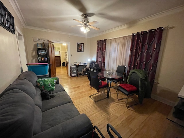 living room with ceiling fan, light wood-type flooring, and ornamental molding