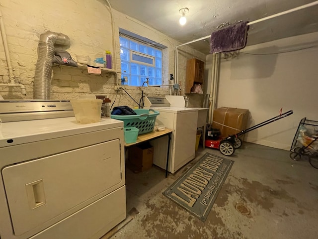 laundry area with separate washer and dryer