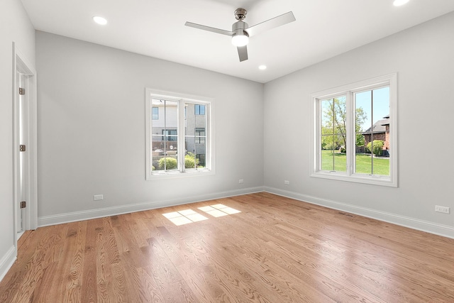 spare room with ceiling fan, light wood-style floors, baseboards, and recessed lighting