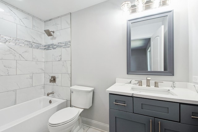 bathroom featuring toilet, baseboards, vanity, washtub / shower combination, and marble look tiles